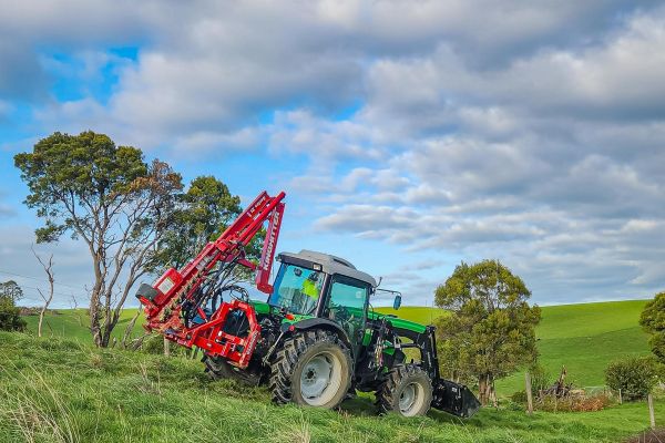Kinghitter Series 2i 450 post driver hinged down on tractor for safe transport in Australia