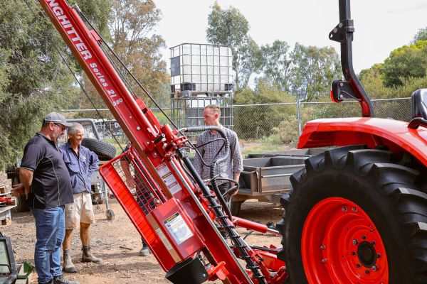 Kinghitter Series 2i post driver on tractor with auger and safety system tilted for fencing in Australia