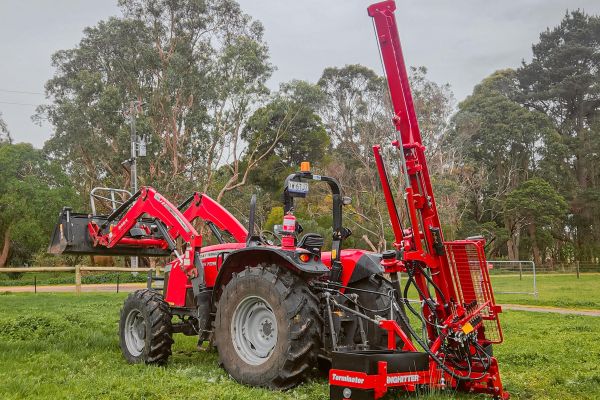 Tractor-mounted Kinghitter 2i 450 post driver with auger and sideshift accessories