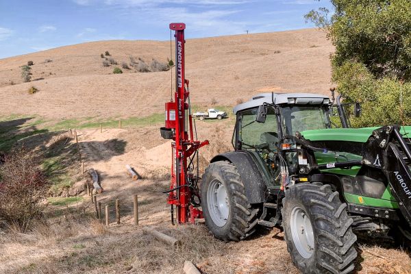 Kinghitter Series 2i 450 post driver mounted on tractor with Dominator Base for fast and accurate post placement in Australia.