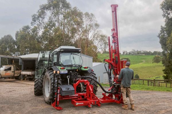 Dealer delivering and demonstrating Kinghitter 2i 450 tractor-mounted post driver in Australia