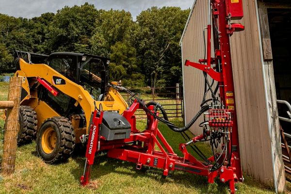 Skidsteer fitted with Kinghitter 2i 450 post driver for fencing in Australia