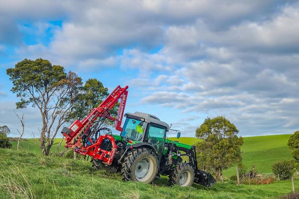 Kinghitter Series 2i 450 post driver hinged down on tractor for safe transport in Australia